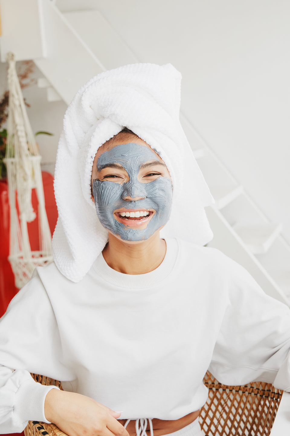 hair-wrapped-in-towel-and-moisterizing-face-mask